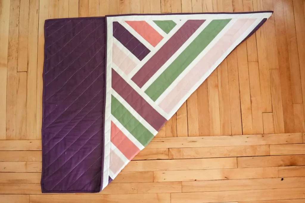 a quilt with the corner folded in.