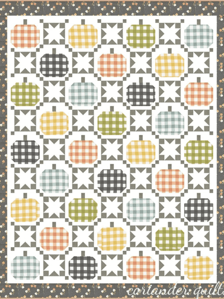An irish chain quilt with gingham pumpkins in the spaces.