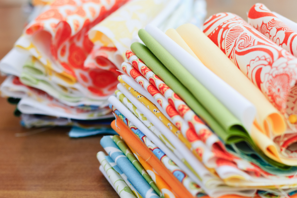 Photo of brightly colored fabric in two stacks